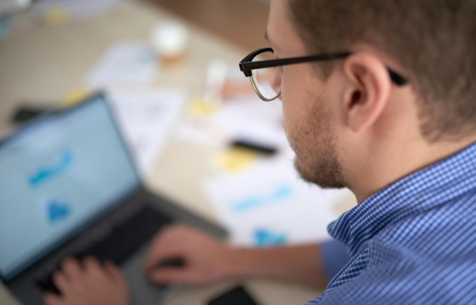 blockchain development workspace with multiple monitors showing smart contract code